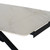 Close-up corner view of the Romanby Stone Extending Dining Table, showing the marble-effect top, rounded corner, and black metal frame with extension mechanism exposed.