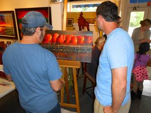 Ford Smith working on new painting at Ashley's Art Gallery