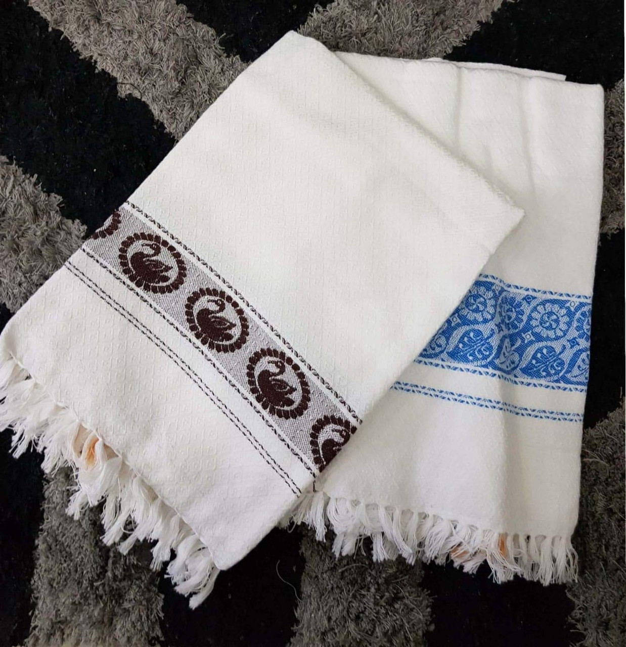 white cotton bath towels