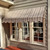 Fabric window awning providing stylish shade and protection for exterior windows.