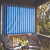 Roll-up fabric curtain for porch or patio, providing customizable shade and privacy solutions for outdoor living spaces.