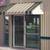 Retro aluminum awning accentuating a door with its timeless design and durable construction.