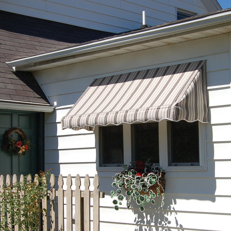 Fabric window awning providing stylish shade and protection for exterior windows.
