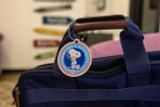 Peanuts “Comfort & Security” Wooden Bag Tag Peanuts “Comfort & Security” Wooden Bag Tag