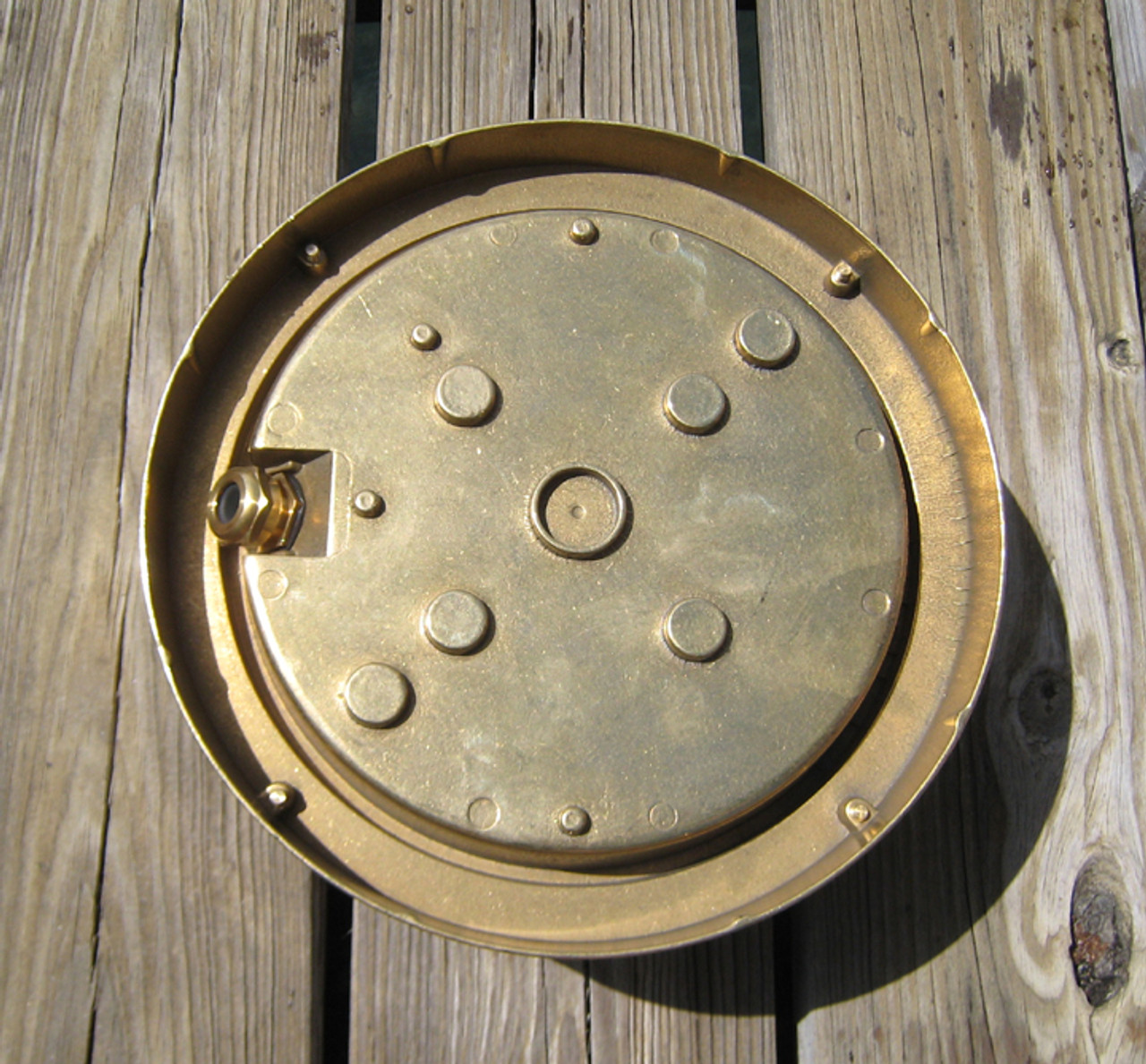 rear view of brass nautical round dock light