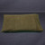 Bottom side of the green fleece Travel Buckwheat Hull Pillow cover, showing the overlap closure system