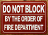 FD DO NOT BLOCK BY ORDER OF FIRE MARSHAL SIGN