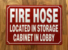 NYC FIRE HOSE LOCATED IN STORAGE CABINET IN LOBBY SIGN