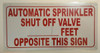 AUTOMATIC SPRINKLER SHUT OFF VALVE_FEET OPPOSITE THIS   BUILDING SIGN