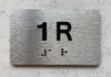 APT# 1R SILVER Ada Sign