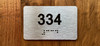 Apartment number 334 Ada Sign