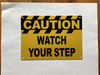 caution-watch-your-step-orange-aluminum-with-mounting-holes.jpg