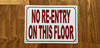 white-no-re-entry-on-this-floor-screw-mount-sign.jpg