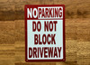 no-parking-do-not-block-driveway-white-safety-sign.jpg