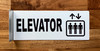 elevator-hallway-white-safety-sign.jpg