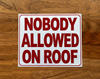 nobody-allowed-on-roof-sign-with-mounting-holes.jpg