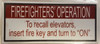 Compliance  FIREFIGHTERS OPERATION TO RECALL ELEVATORS INSERT FIRE KEY AND TURN TO ON  (ALUMINUM S,WHITE) sign