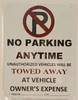 BUILDING SIGNAGE NO PARKING ANYTIME UNAUTHORIZED VEHICLES WILL BE TOWED AWAY