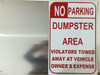 NO PARKING DUMPSTER AREA VIOLATORS TOWED AWAY AT VEHICLE OWNER'S EXPENSE