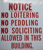 NO LOITERING NO PEDDLING NO SOLICITING ALLOWED IN THIS BUILDING  BUILDING SIGNAGE