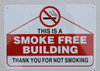 SIGN THIS IS A SMOKE FREE BUILDING THANK YOU FOR NOT SMOKING