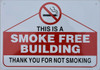 BUILDING SIGNAGE THIS IS A SMOKE FREE BUILDING THANK YOU FOR NOT SMOKING