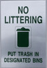 Building NO LITTERING PUT TRASH IN DEATED BINS   sign