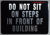 DO NOT SIT ON Steps in Front of Building Sign