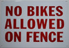 SIGN NO Bikes Allowed ON Fence