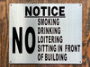 NO SMOKING DRINKING LOITERING SITTING IN FRONT OF BUILDING SIGN