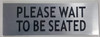 Please Wait to BE Seated Sign