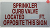 SPRINKLER CURB VALVE LOCATED FT OPPOSITE THIS Signage