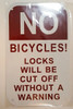 SIGNAGE NO BICYCLES LOCKS WILL BE CUT OFF WITHOUT A WARNING - WHITE BACKGROUND (ALUMINUM S 8X5)