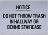 NOTICE: DO NOT THROW TRASH IN HALLWAY OR BEHIND STAIRCASE SIGN