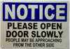 Please open door slowly SIGN