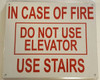 Compliance  IN CASE OF FIRE DO NOT USE ELEVATOR USE STAIRS - REFLECTIVE !!!  sign