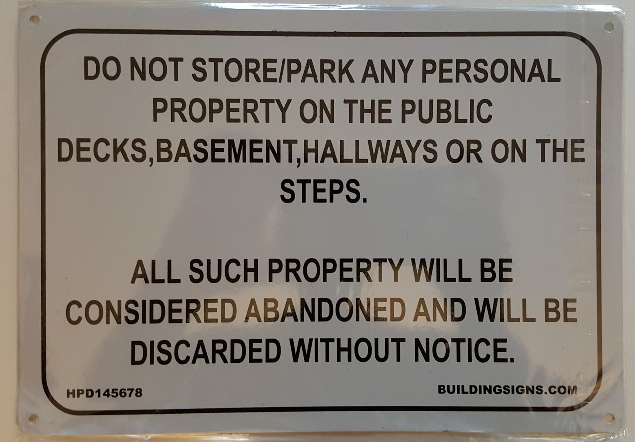NO STORAGE IN HALLWAY SIGN