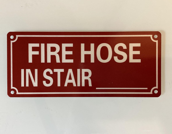NYC FIRE HOSE IN STAIR BLANK SIGN