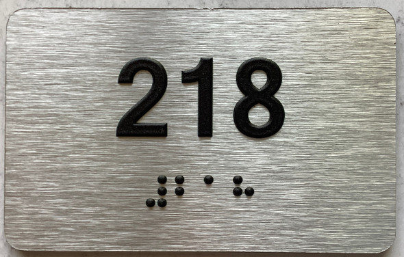 apartment number 218 sign