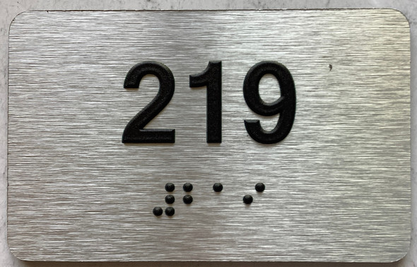 apartment number 219 sign