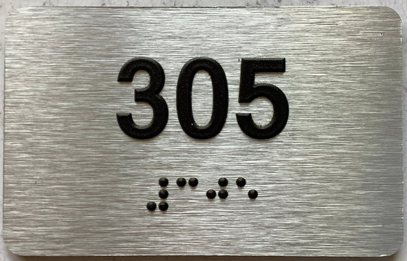 apartment number 305 sign