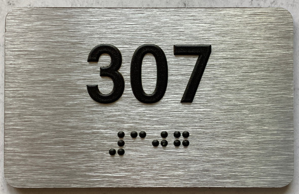 apartment number 307 sign