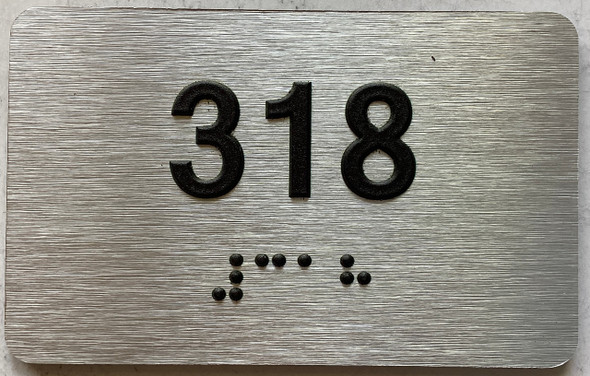 apartment number 318 sign