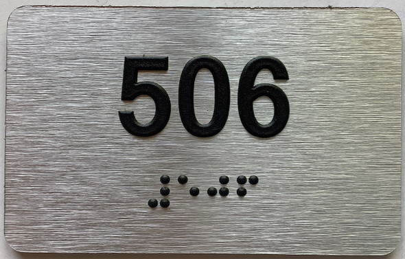 apartment number 506 sign