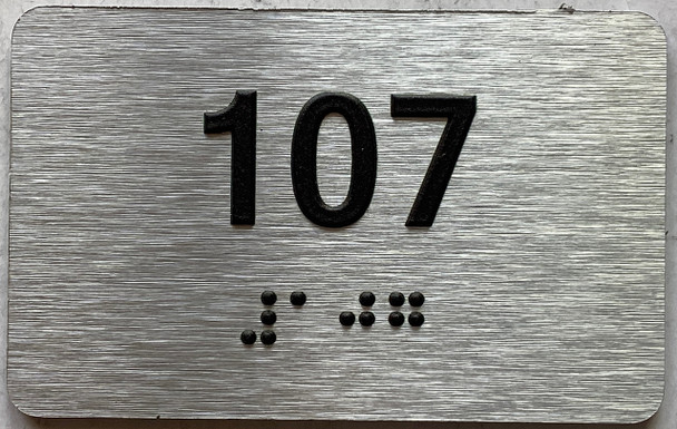 apartment number 107 sign