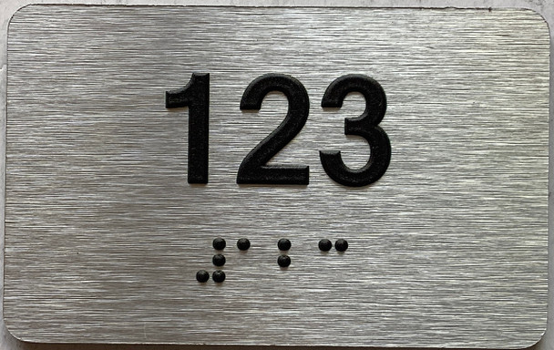 apartment number 123 sign