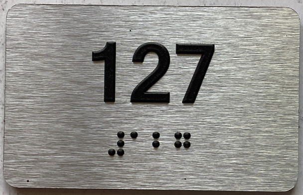 apartment number 127 sign