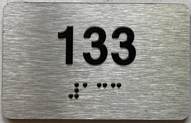 apartment number 133 sign