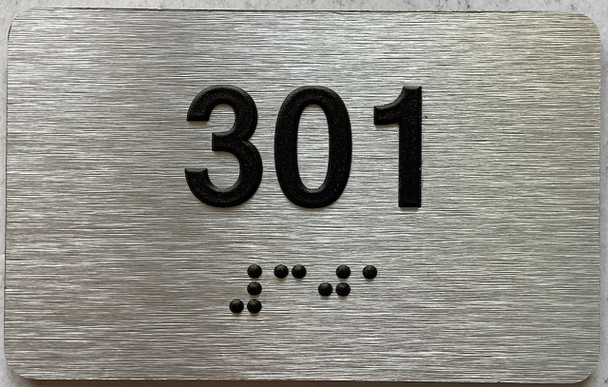 apartment number 301 sign