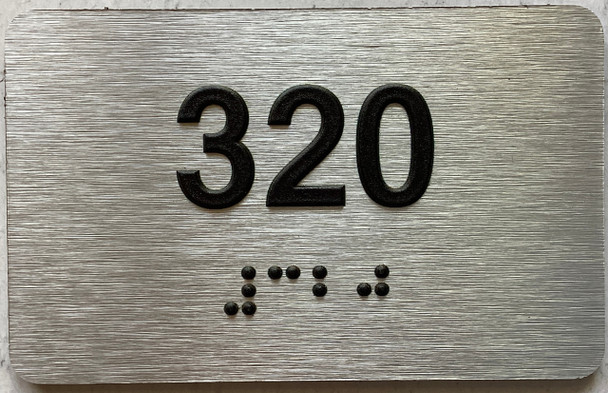 apartment number 320 sign